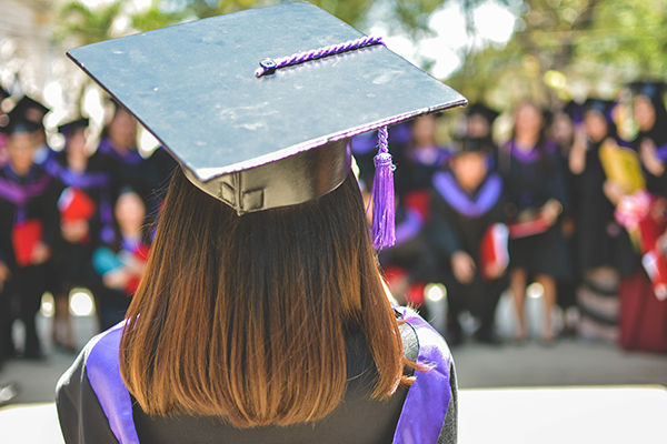 a college graduate in gown and cap