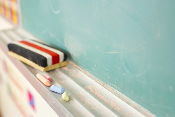 eraser and chalk on chalkboard