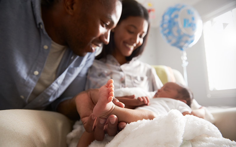 Black couple with newborn