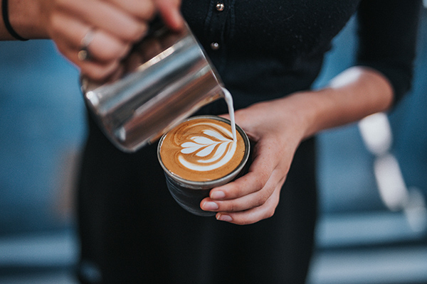 Young person working at a coffee shop