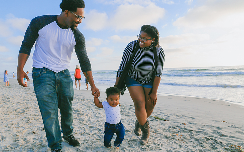 Family walking on beach