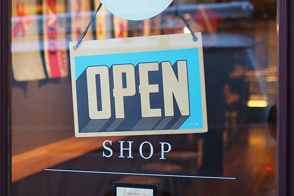 Open sign on door of retail store