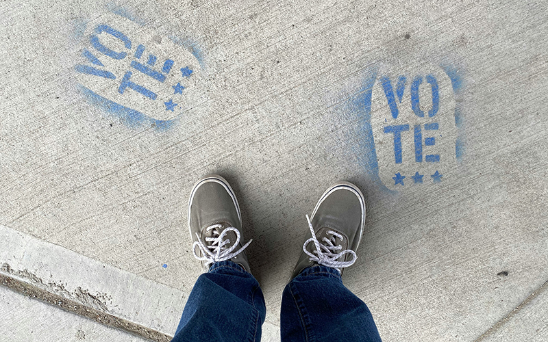 Vote stamped on sidewalk