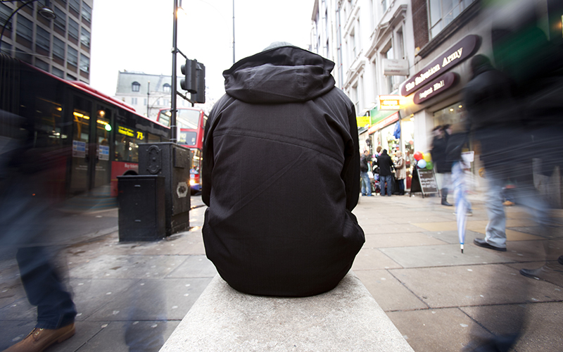 man sitting on bench