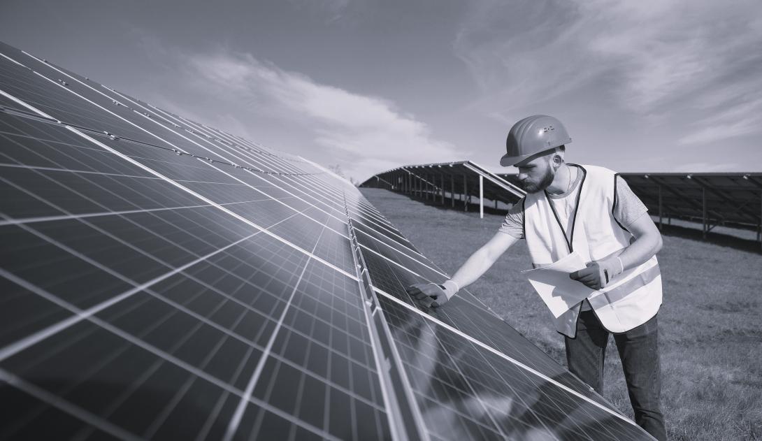 man working on solar panel